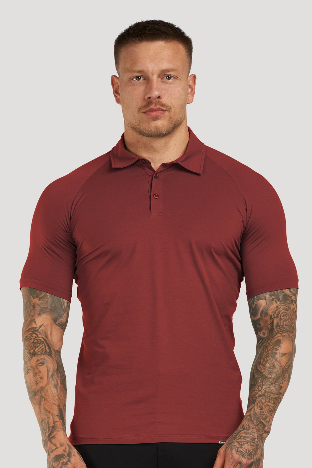 THE MUSCLE BUTTON POLO